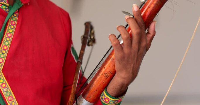 Traditional folk artists performing Hadauti music in Kota, dressed in colorful Rajasthani attire with instruments.