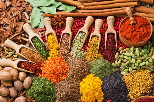Dried Himalayan herbs and spices displayed in small woven baskets.