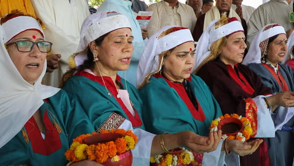 A family viewing the traditional Navreh Thaal at dawn, a unique new year ritual of Jammu and Kashmir for Kashmiri Pandits.