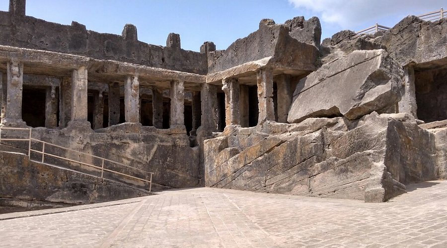 The dark, carved interiors of the Khapra Kodiya Caves.