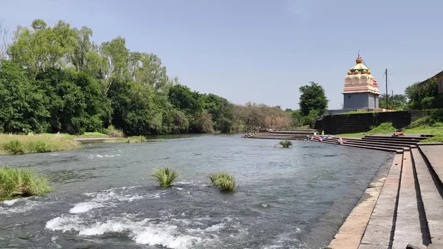 Serene Krishna River Ghats at sunset, a peaceful riverside place to visit in Amaravati.