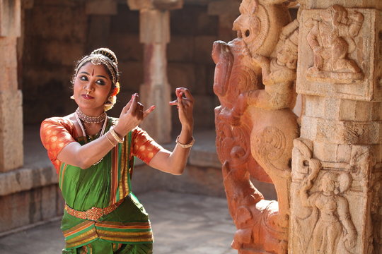 Classical dancer in traditional costume performing Kuchipudi dance.