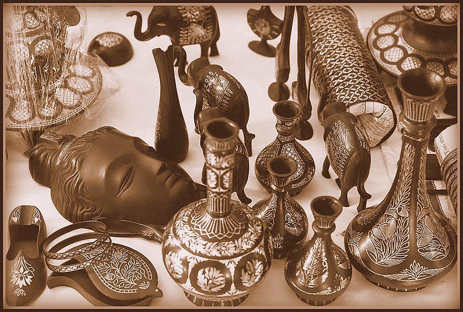 A craftsman shaping ornate Metalware.