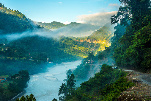 A photographer capturing the golden hour light on the banks of the Sharda River in Lakhimpur Kheri.