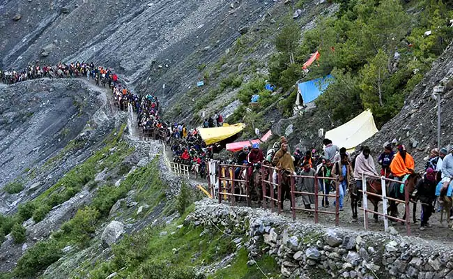 Devotees on the arduous trek to the Amarnath Cave, showcasing the profound pilgrimage rituals of Jammu and Kashmir.