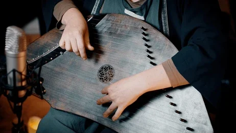 Artists on stage performing a vibrant Rasiya and Birha folk dance in Lakhimpur Kheri.