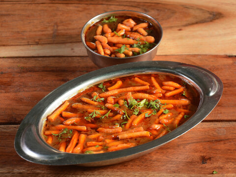 Sev Tamatar ki Sabzi, a tangy tomato and sev curry.