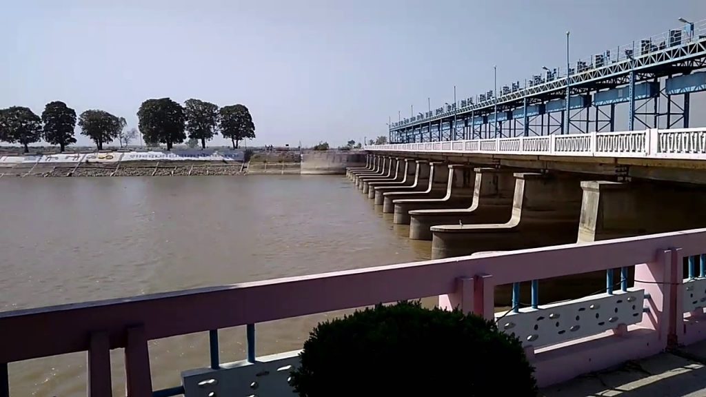 Water gushing through the gates of the massive Sharda Barrage.