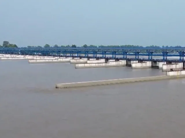 A serene sunset view over the flowing waters of the Sharda River in Lakhimpur Kheri.