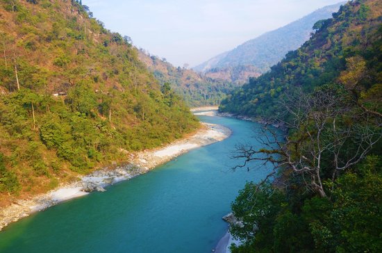 Wide view of Teesta River flowing through the Dooars region.
