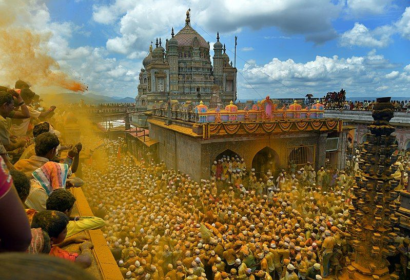 A grand Rathotsava procession during a temple festival, showcasing the vibrant communal temple rituals of Maharashtra.