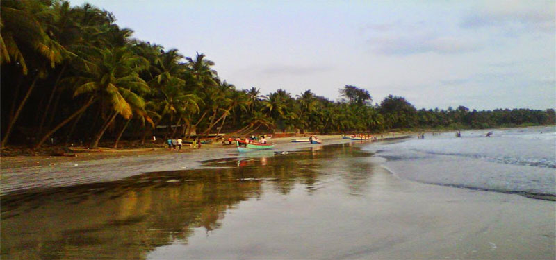 Expansive coastline and distant ships at Thal Beach.