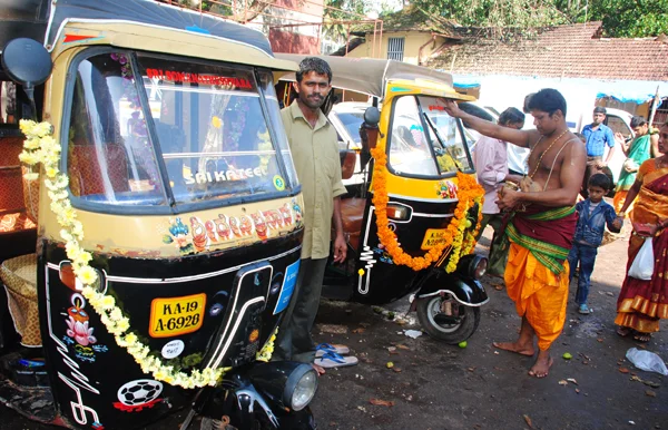 Decorated tools and vehicles with flowers during the Dasara festival.