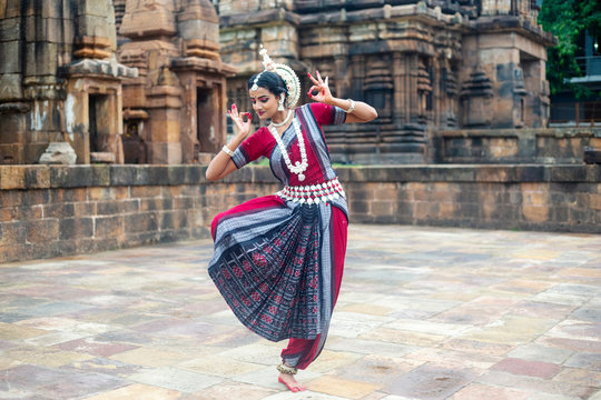 Performers in vibrant traditional attire executing a dynamic Tribal Folk Dance.