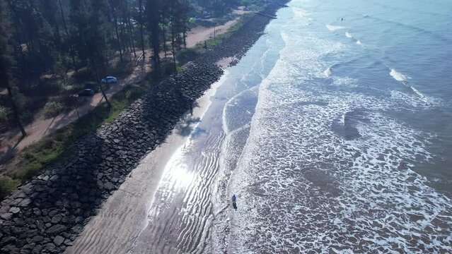 Quiet shoreline of Versoli Beach, a peaceful and less-crowded place to visit in Alibag.