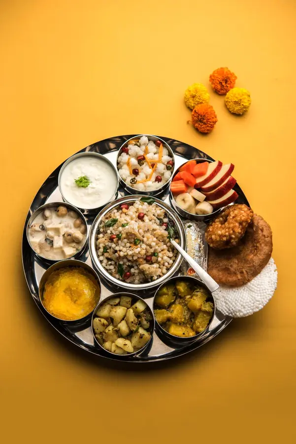 A woman observing a fast during Vows & Fasting (Vrat/Upvas), disciplined rituals of Bihar.