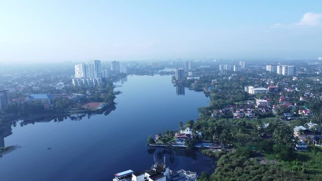Serene backwaters in Kochi with traditional houseboats, a peaceful place to visit in Ernakulam.