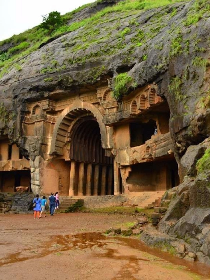 The rock-cut stupas and intricate carvings inside the prayer hall of the historic Bhaja Caves.