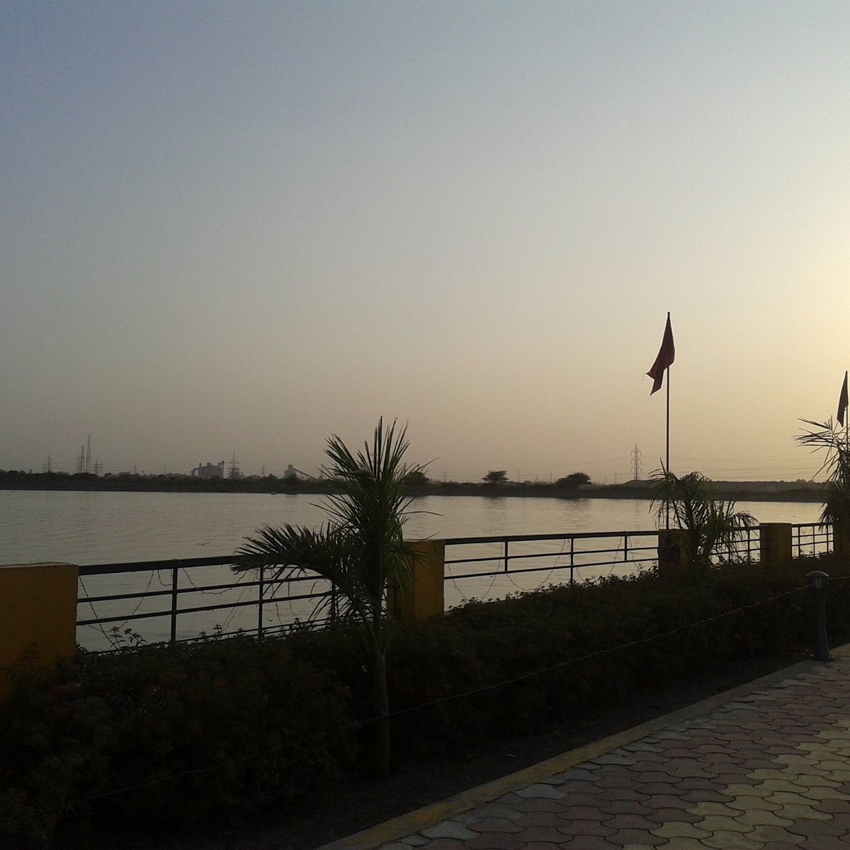 Peaceful boating experience at Bathinda Lake with families enjoying paddle boats on calm waters