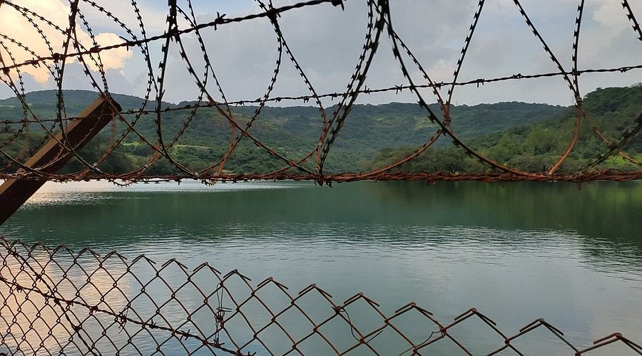 Bushy Dam peaceful waters surrounded by dense forest vegetation, a nearby places to visit Khandala for picnics and relaxation.