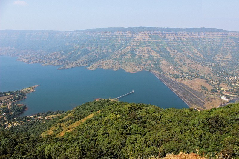 Boating activities and calm waters at the Dhom Dam reservoir near Wai.
