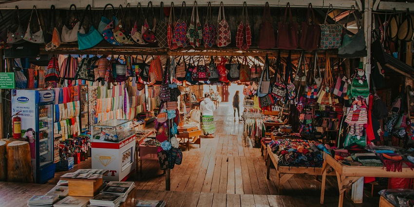 Shoppers exploring vibrant local markets filled with handicrafts and souvenirs in Orchha.