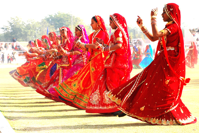 Women performing the graceful Ghoomar dance in colorful traditional attire.