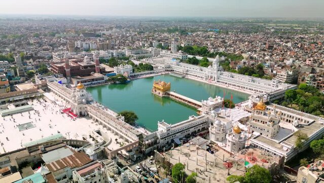 Golden dome and marble architecture of the Harmandir Sahib complex in Amritsar.