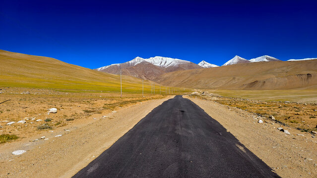 Bike riding through rugged terrain on a high-altitude road trip in Lahaul and Spiti.