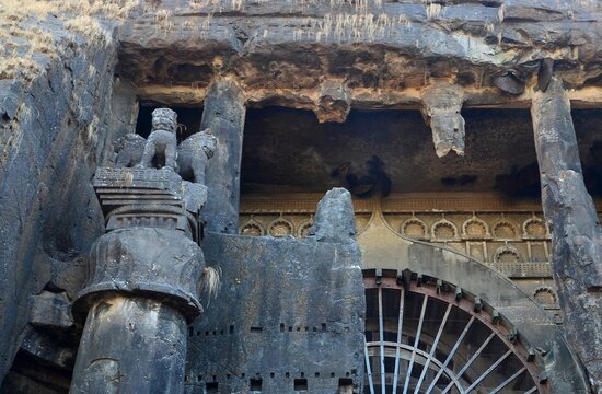 The ancient rock-cut architecture of the Karla Caves, a historic Buddhist site located near Khandala with intricate carvings and pillars.