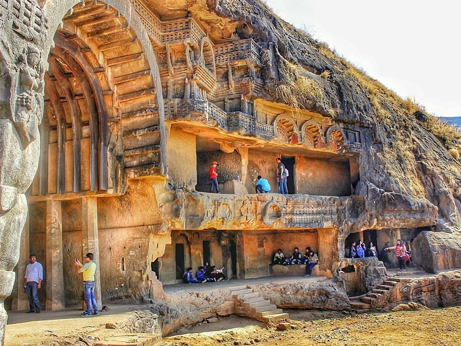 Ancient Karla Caves intricate rock-cut architecture with Chaitya hall pillars, a historic places to visit Khandala dating back 2000 years.