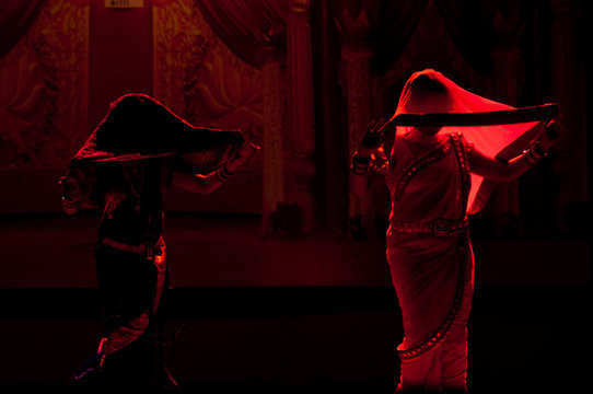 Energetic Lavani dancers performing with rhythmic steps and traditional jewelry, a key part of Maharashtra's folk heritage.