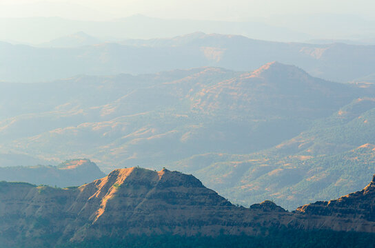 A stunning panoramic view of Mahabaleshwar's lush green hills and valleys during the monsoon season.