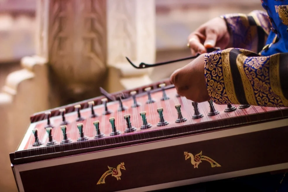 Women singing auspicious Mangal Geet during a wedding celebration in Chopta villages.