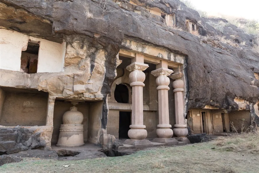 Intricate rock-cut carvings and ancient temple structures at Pateshwar Caves.