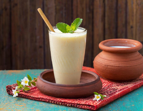Creamy Patiala Lassi served in tall glass with malai topping