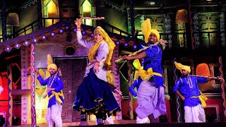 Dancers performing the vibrant Phag dance celebrating the harvest season in Haryana.