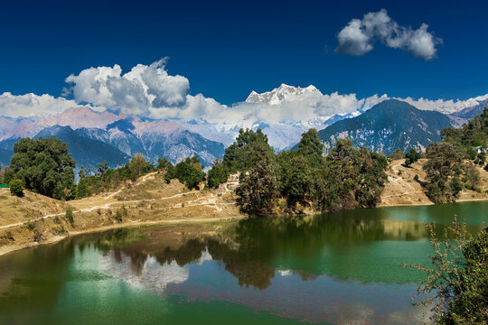 A photographer capturing the perfect reflection of Himalayas in Deoria Tal near Chopta.