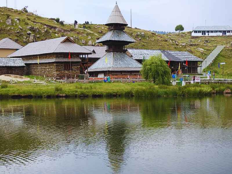 Sacred lake with floating island and pagoda-shaped temple.