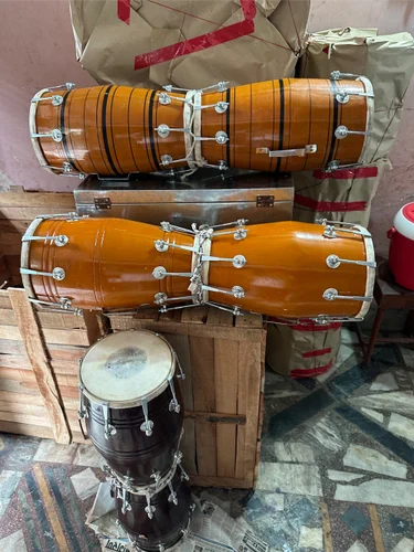 A group of Qawwali singers passionately performing at a dargah.