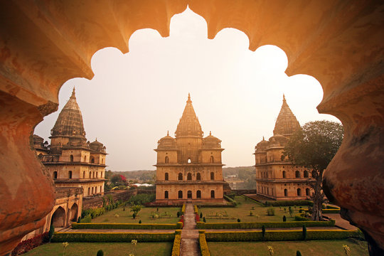 The elegant Royal Chhatris (cenotaphs) standing along the Betwa River banks in Orchha.