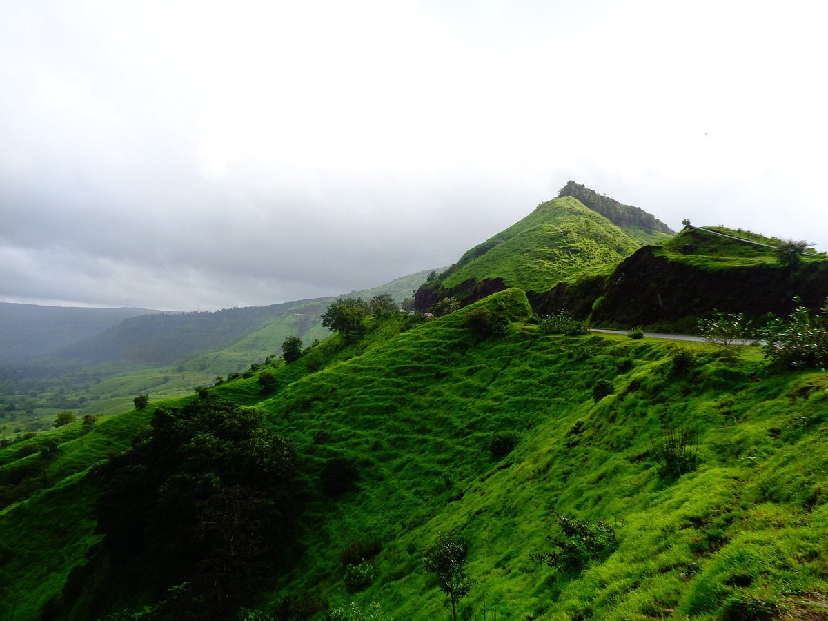 Devotees climbing the steps to seek blessings at sacred Sajjangad Fort in Satara