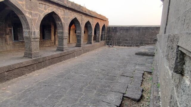 Ancient Shiva temple at Shikhar Shinganapur surrounded by lush green farmland in Satara