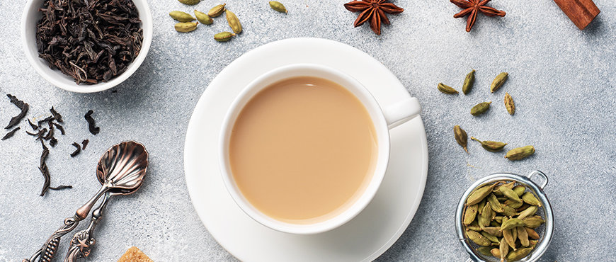 Aromatic Himalayan tea and spices including cardamom, cinnamon, and organic tea leaves