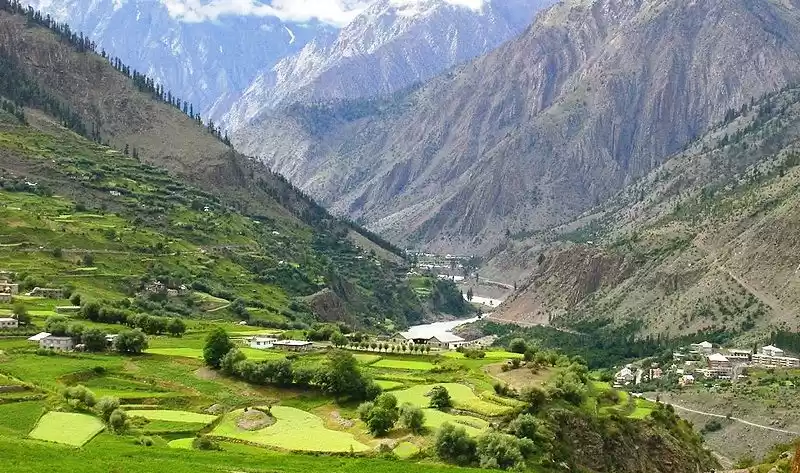 Lush green apple orchards in Udaipur, a beautiful contrast to other places to visit in Lahaul and Spiti.