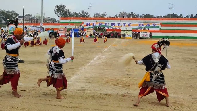 Energetic war dance of the Khasi youth, holding shields and swords, jumping in unison
