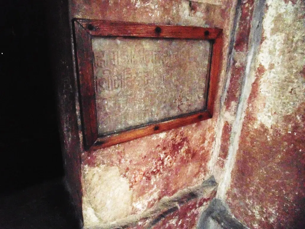 Ancient Sanskrit inscription in Nagari script preserved in a wooden frame on the door jamb of the antarala of Gauri Shankar Temple, Bhedaghat