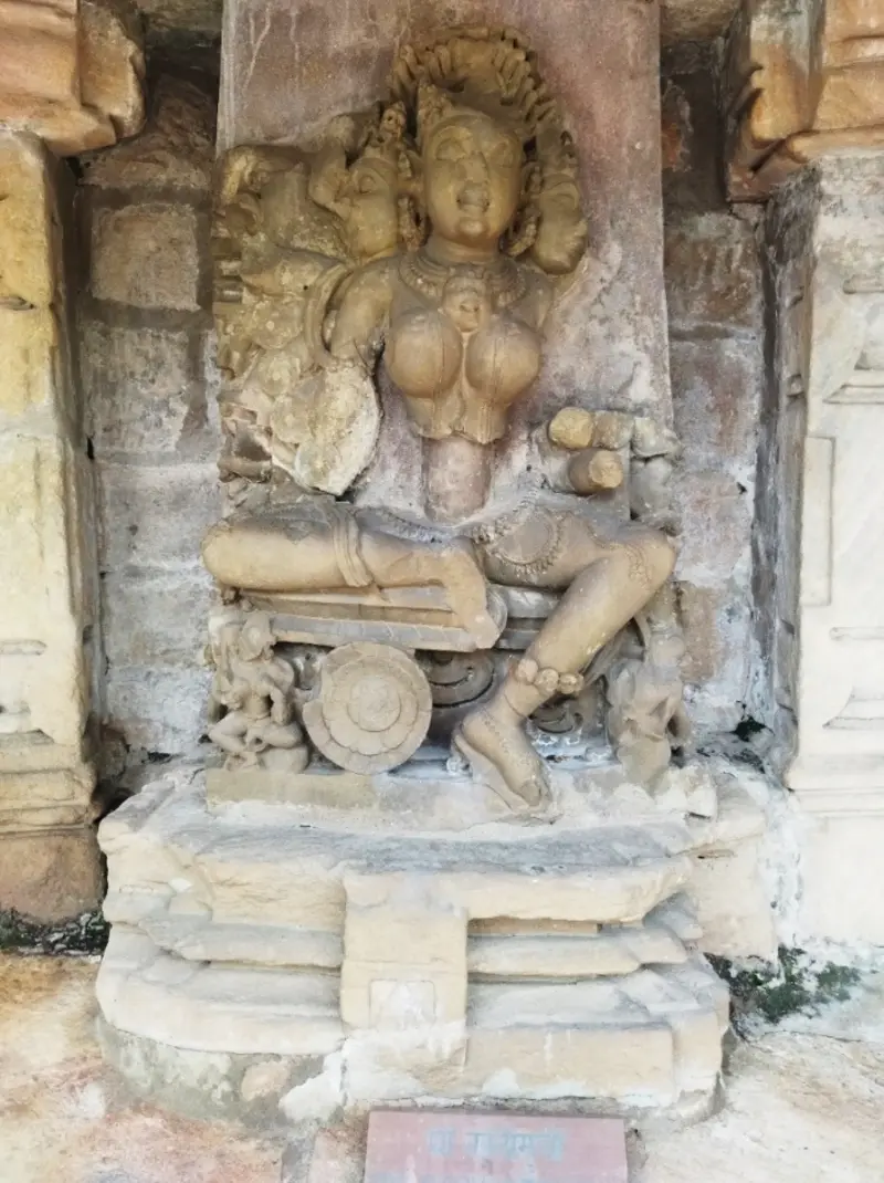 Multi-armed Yogini Sri Sarvottamukhi stone sculpture in a niche at Chausath Yogini Temple Bhedaghat, Kalachuri period 10th–11th century CE