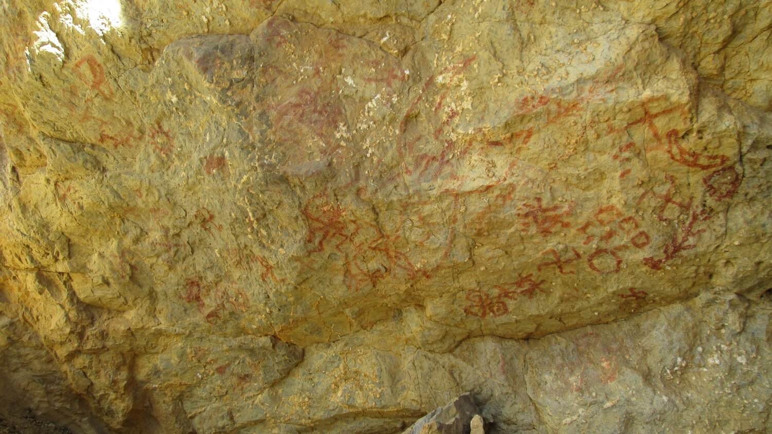 Pictographs: Figures like swastika, animals, sun, moon and Human.